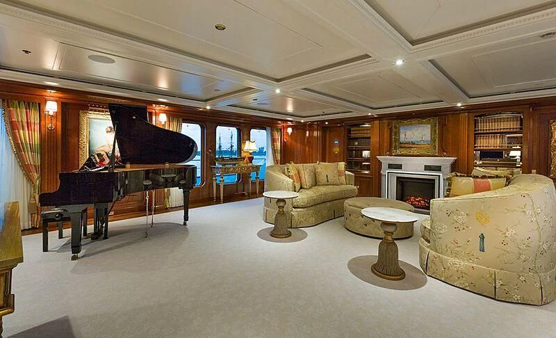 a living room with a piano and a piano aboard KATHARINE Yacht for Sale