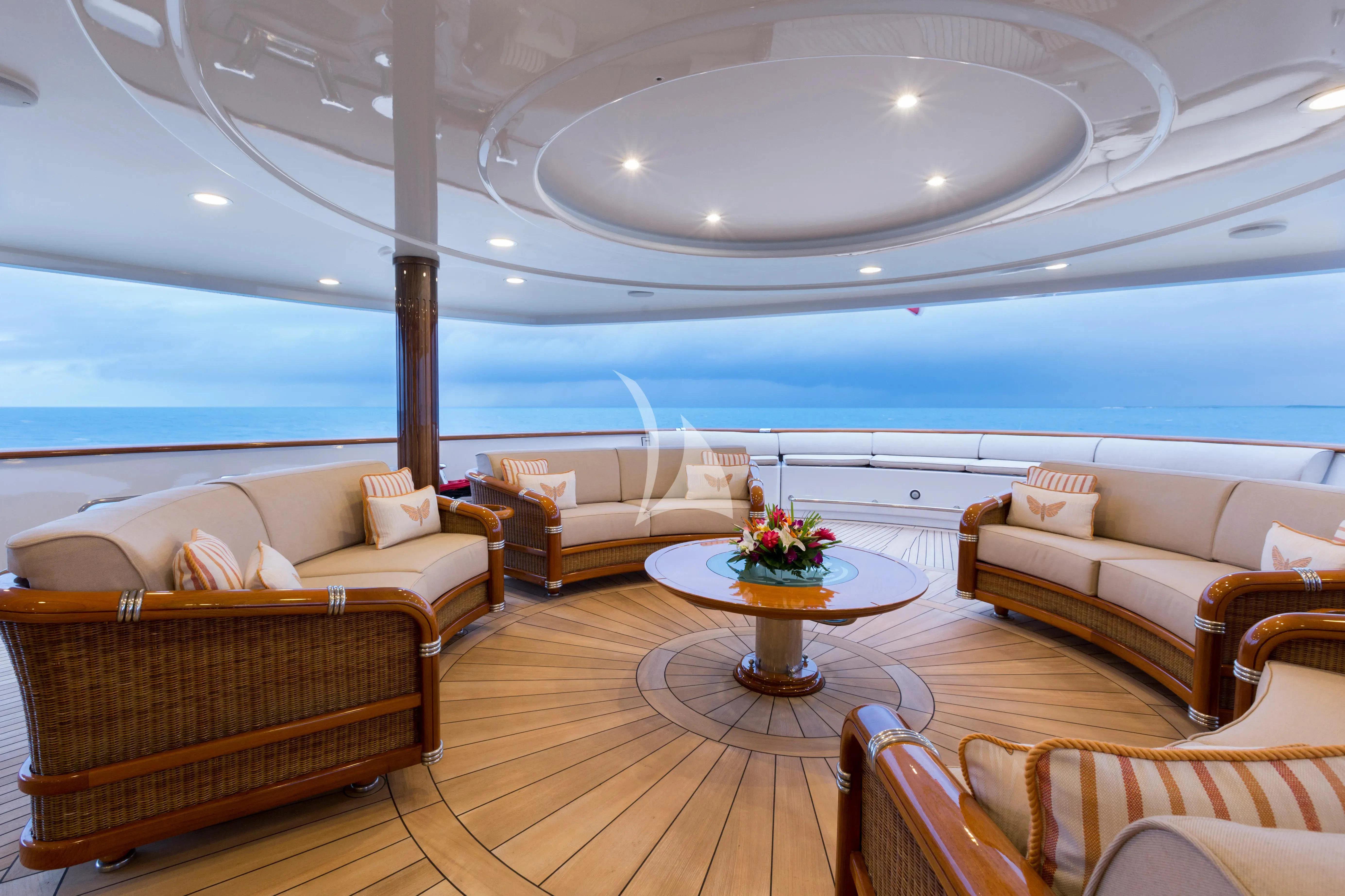 a living room with a table and chairs aboard KATHARINE Yacht for Sale