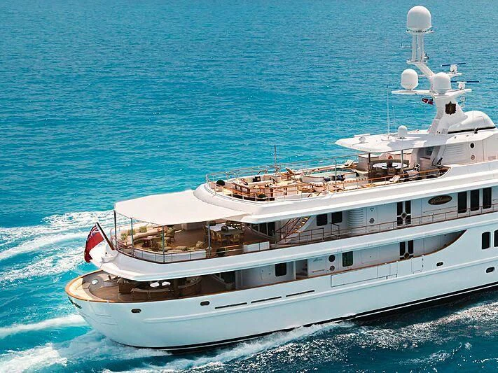 a couple of large white yachts in the water aboard KATHARINE Yacht for Sale