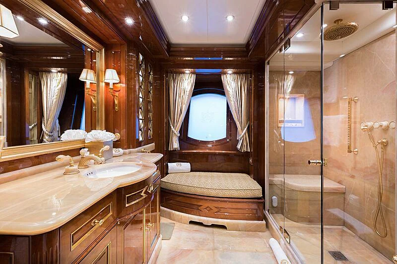 a bathroom with a large mirror aboard KATHARINE Yacht for Sale