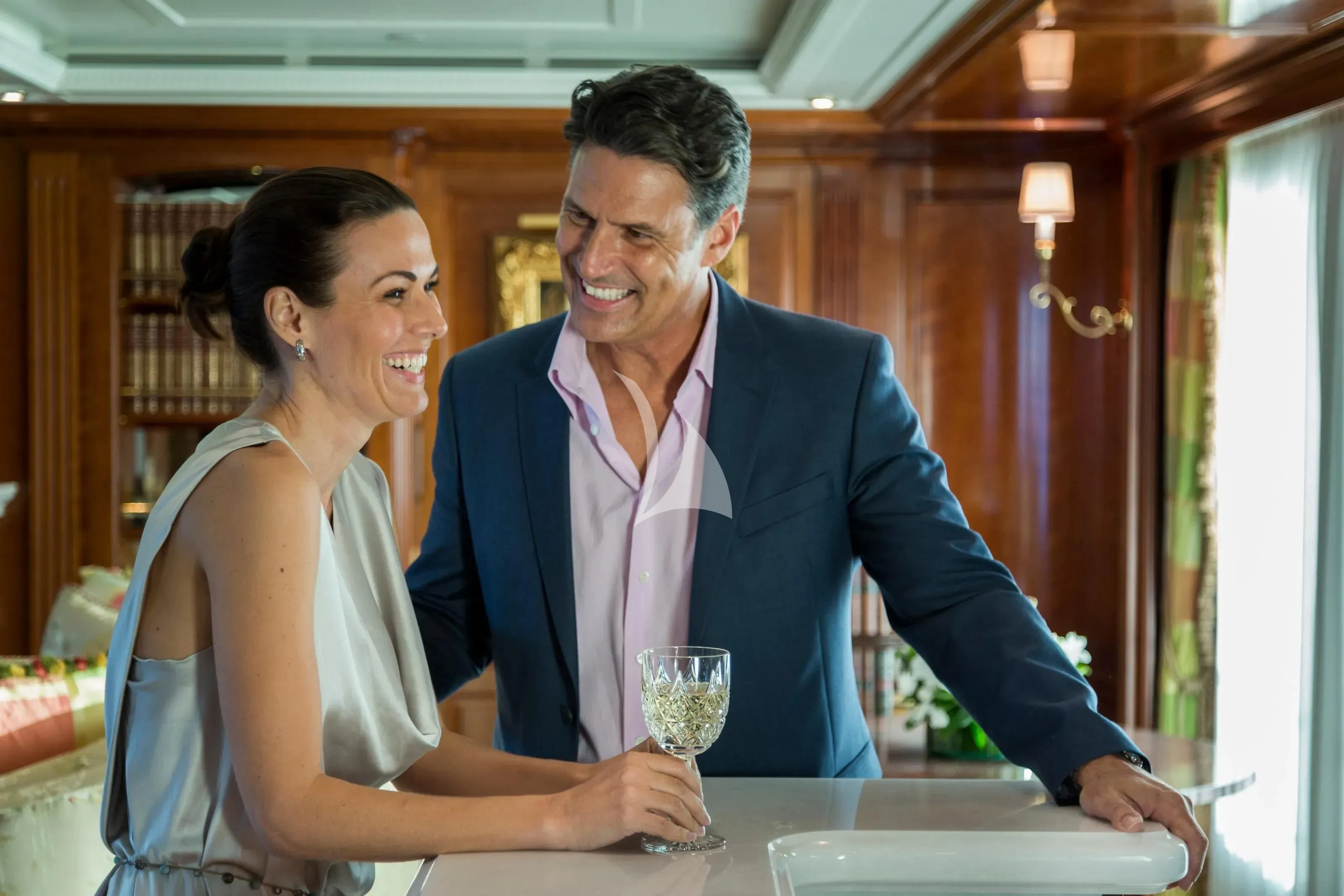 a man and a woman having a conversation aboard KATHARINE Yacht for Sale