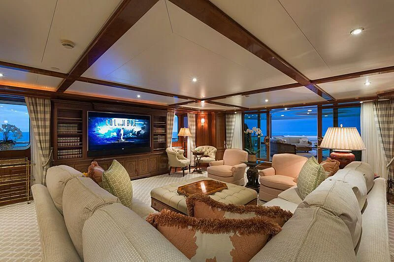 a living room with a large screen aboard KATHARINE Yacht for Sale