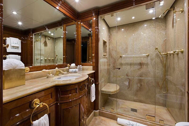 a bathroom with a large mirror aboard KATHARINE Yacht for Sale