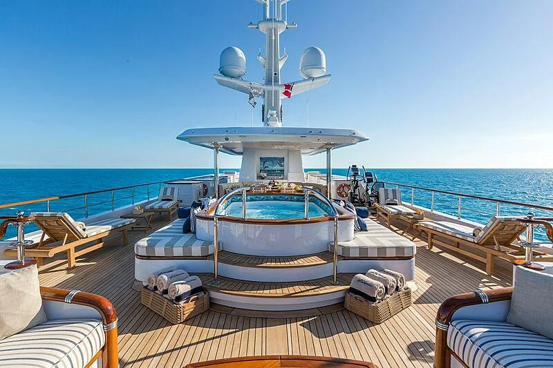 a boat on a deck with a large white satellite dish on top aboard KATHARINE Yacht for Sale