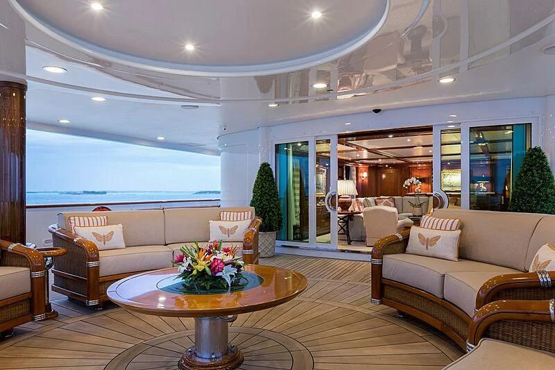 a living room with a table and couches aboard KATHARINE Yacht for Sale