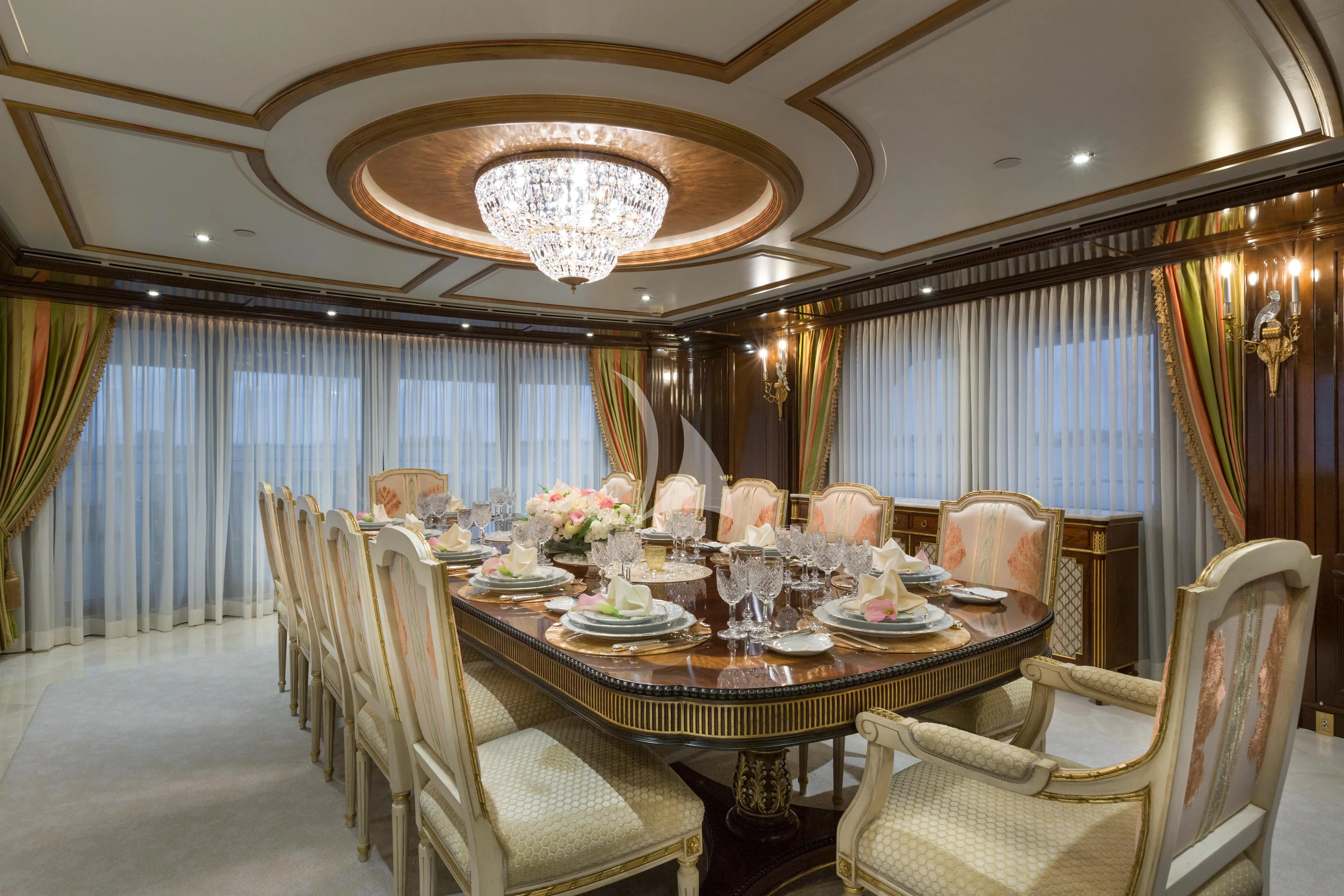 a dining room with a table set aboard KATHARINE Yacht for Sale