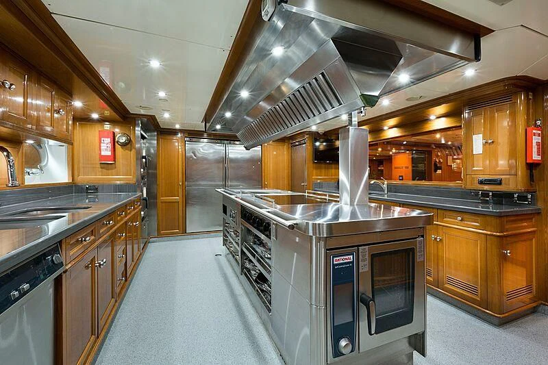 a kitchen with a stainless steel stove aboard KATHARINE Yacht for Sale