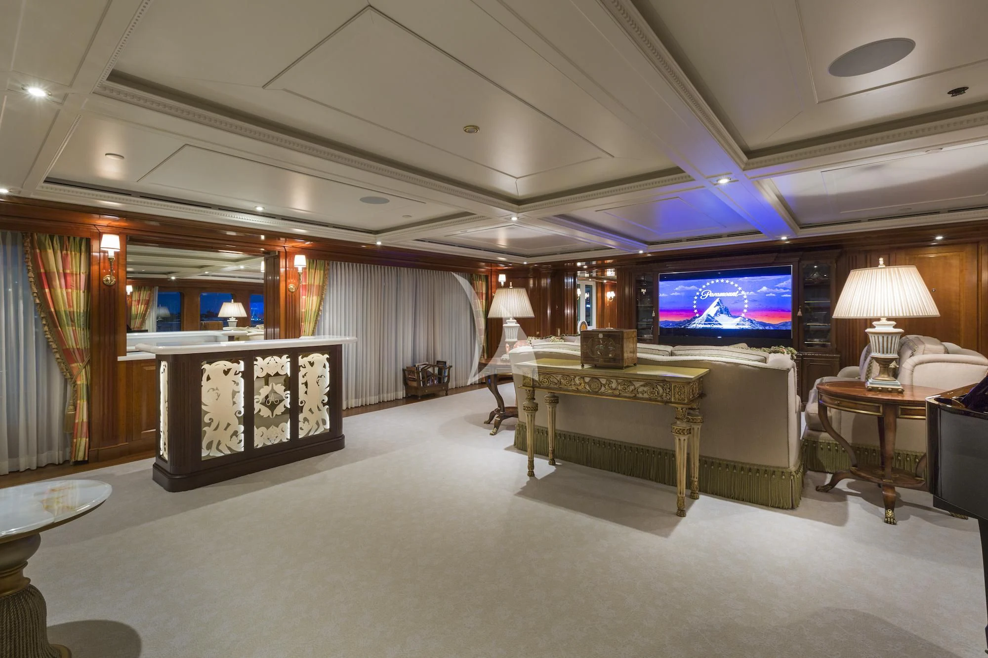 a room with a table and a tv aboard KATHARINE Yacht for Sale