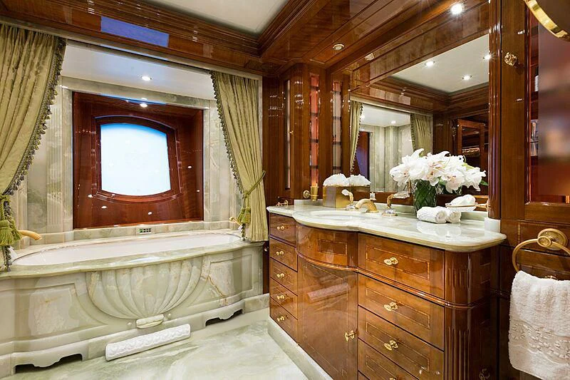 a bathroom with a large mirror aboard KATHARINE Yacht for Sale