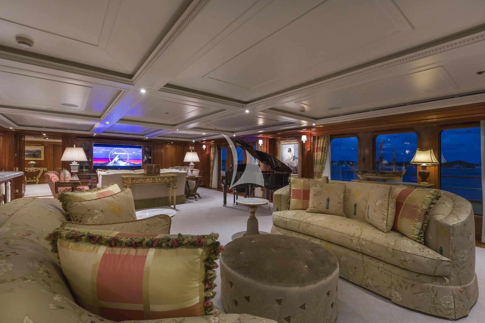 a living room with couches and a television aboard KATHARINE Yacht for Sale