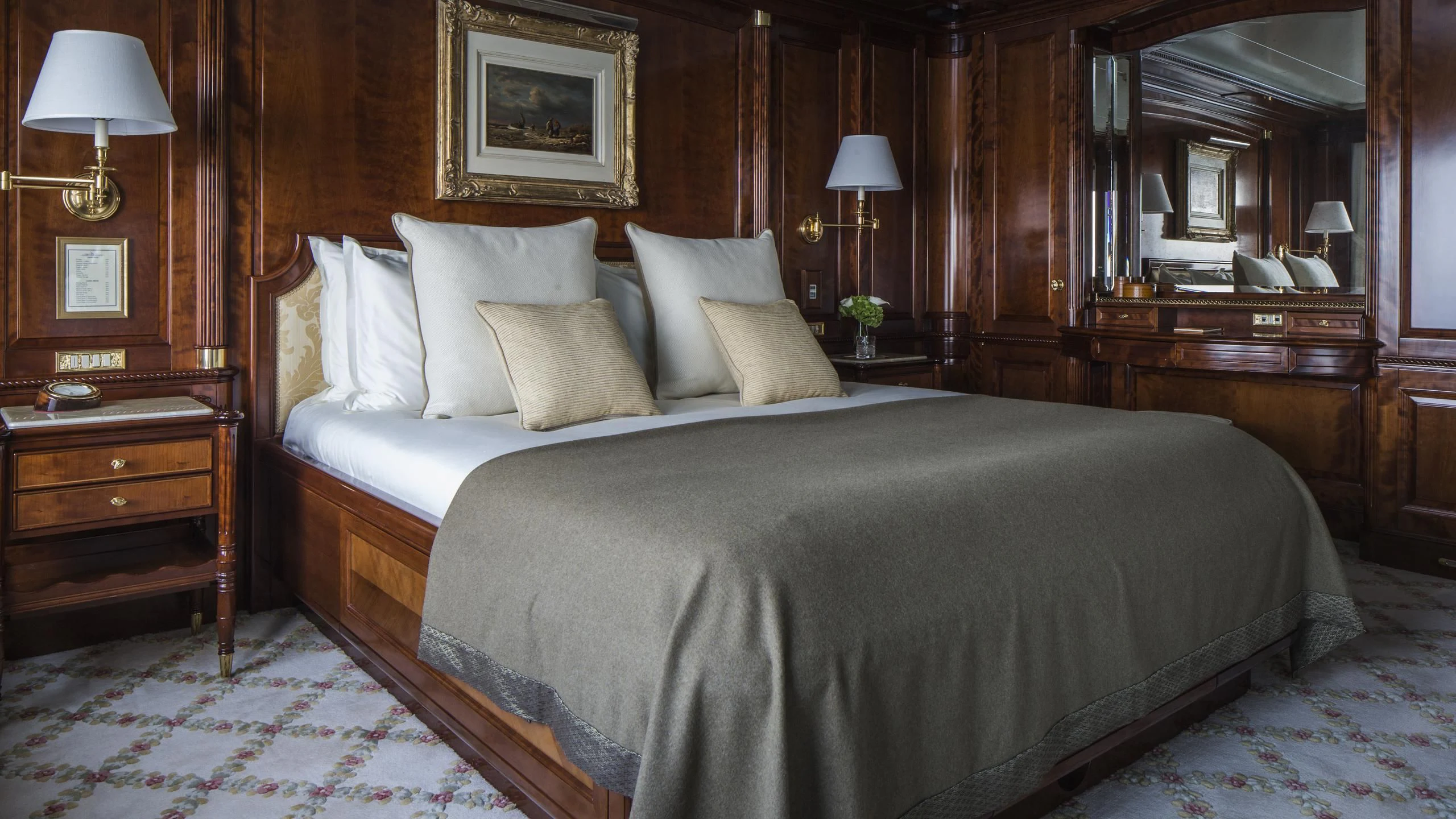 a bed with white pillows aboard KATHARINE Yacht for Sale