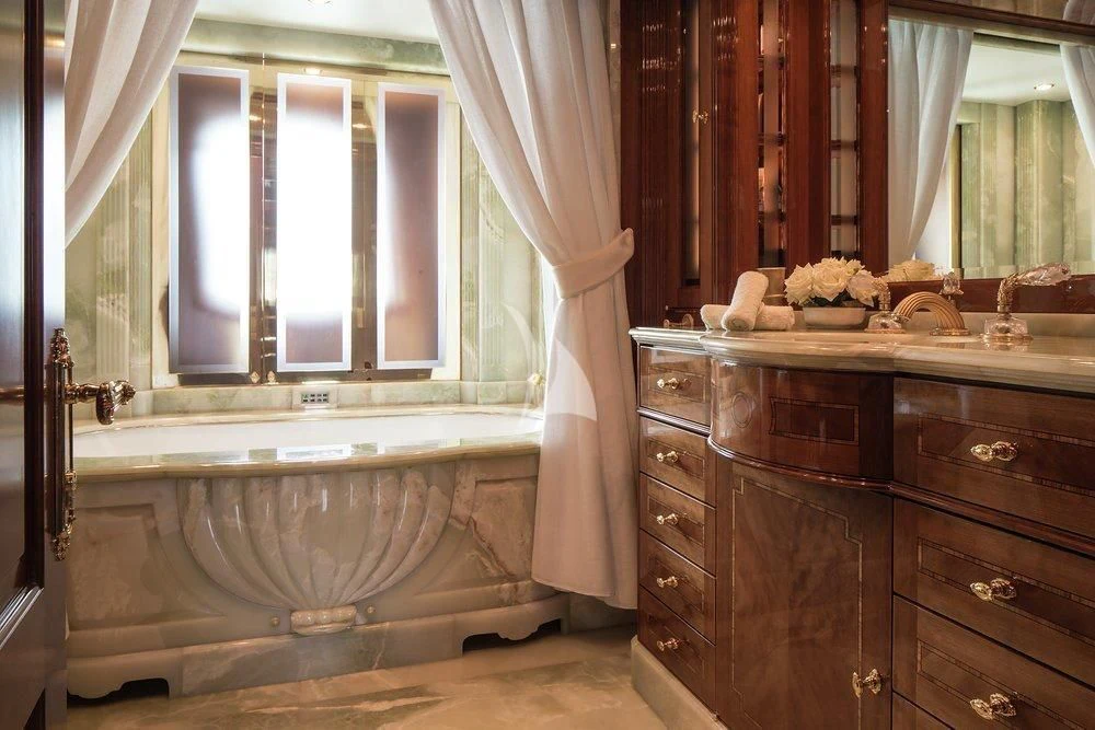 a bathroom with a bathtub and a sink aboard KATHARINE Yacht for Sale