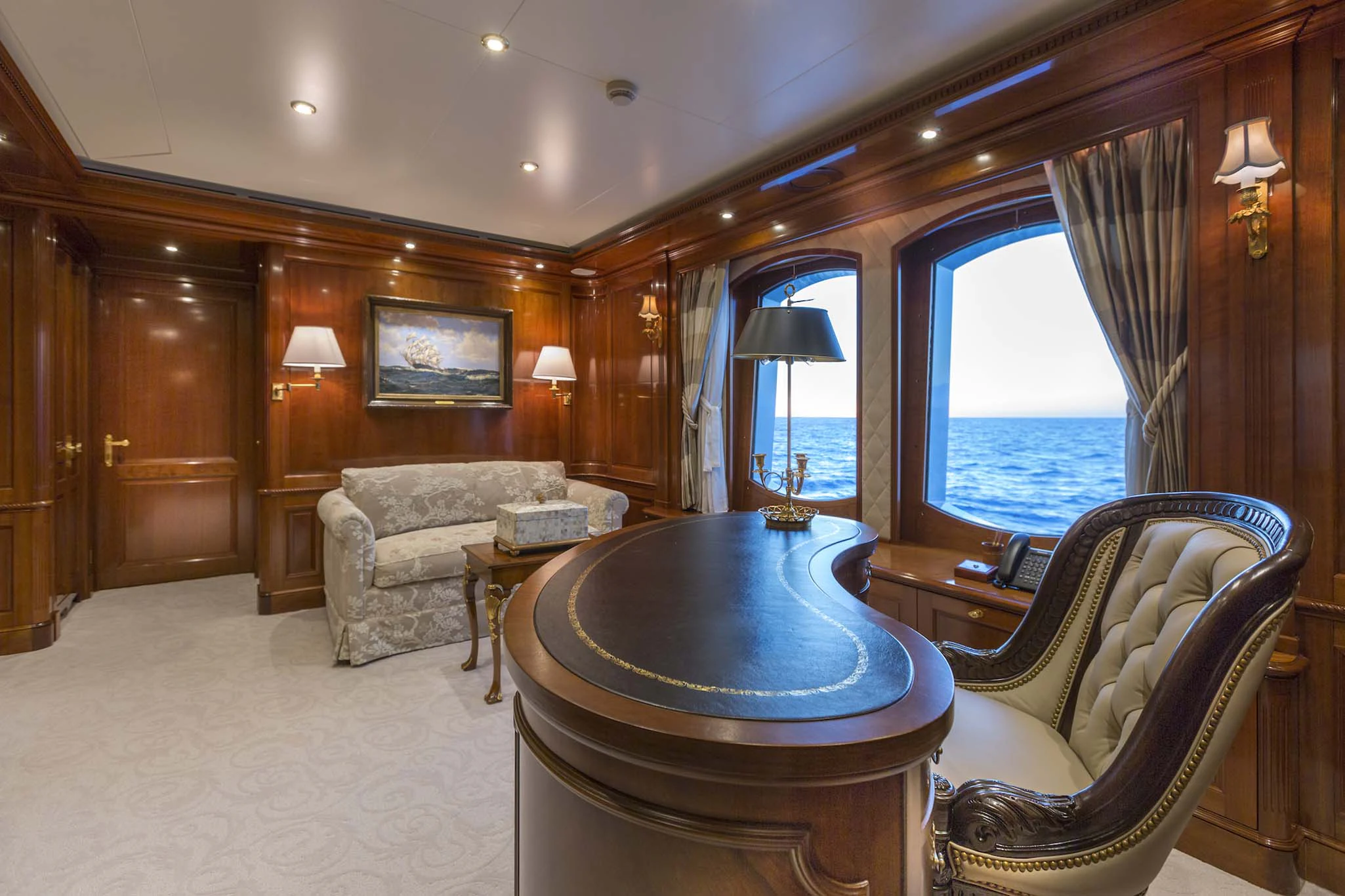 a living room with a table and chairs aboard KATHARINE Yacht for Sale