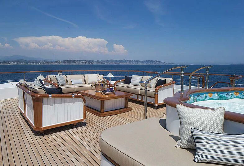 a room with a view of the ocean and a large city aboard KATHARINE Yacht for Sale