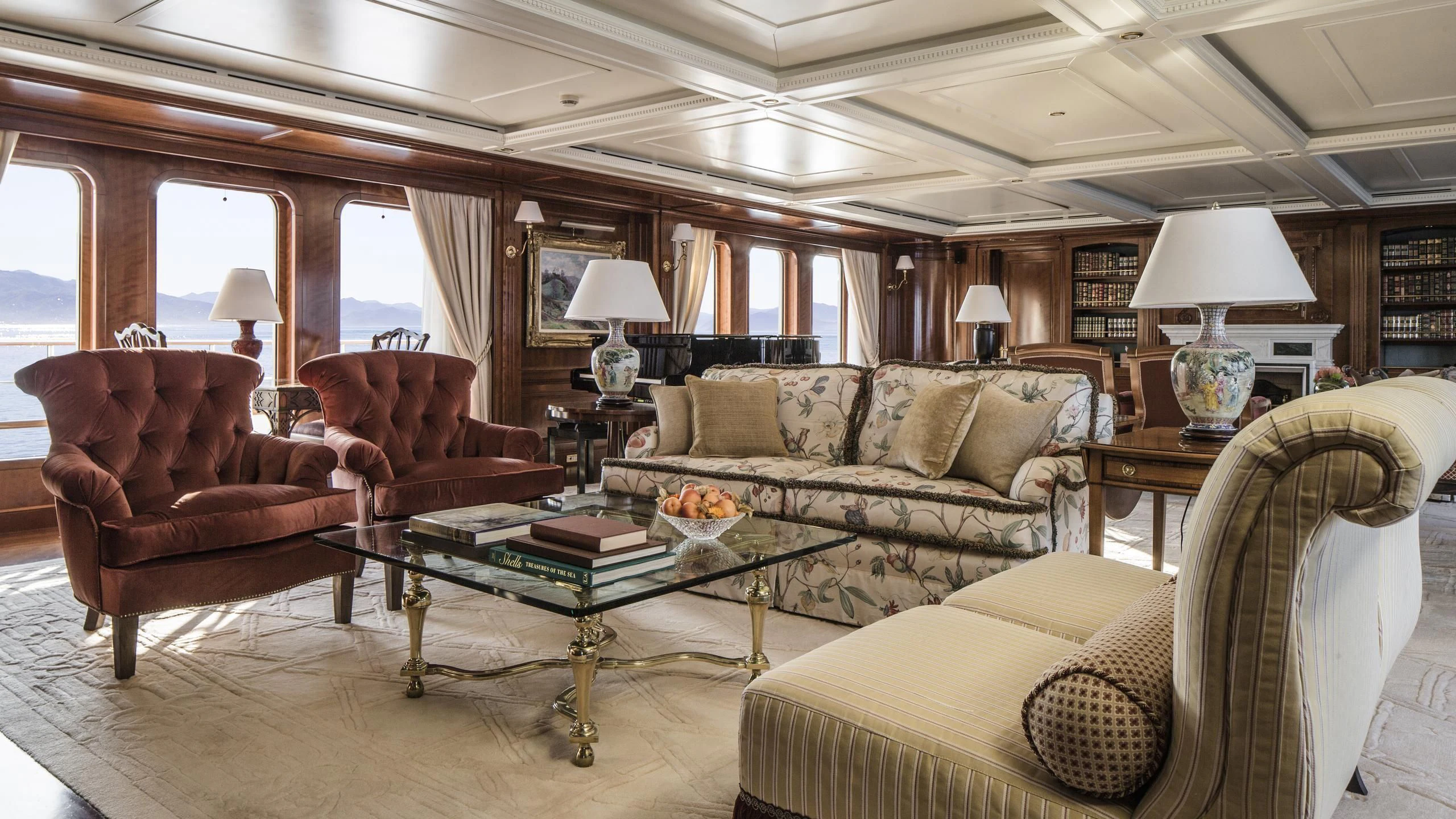 a living room with a couch and a coffee table aboard KATHARINE Yacht for Sale