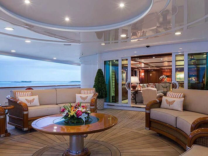 a living room with a table and couches aboard KATHARINE Yacht for Sale