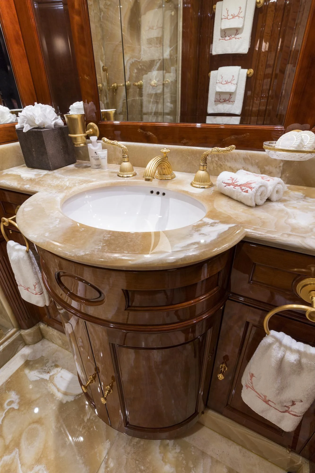 a bathroom with a sink and mirror aboard KATHARINE Yacht for Sale