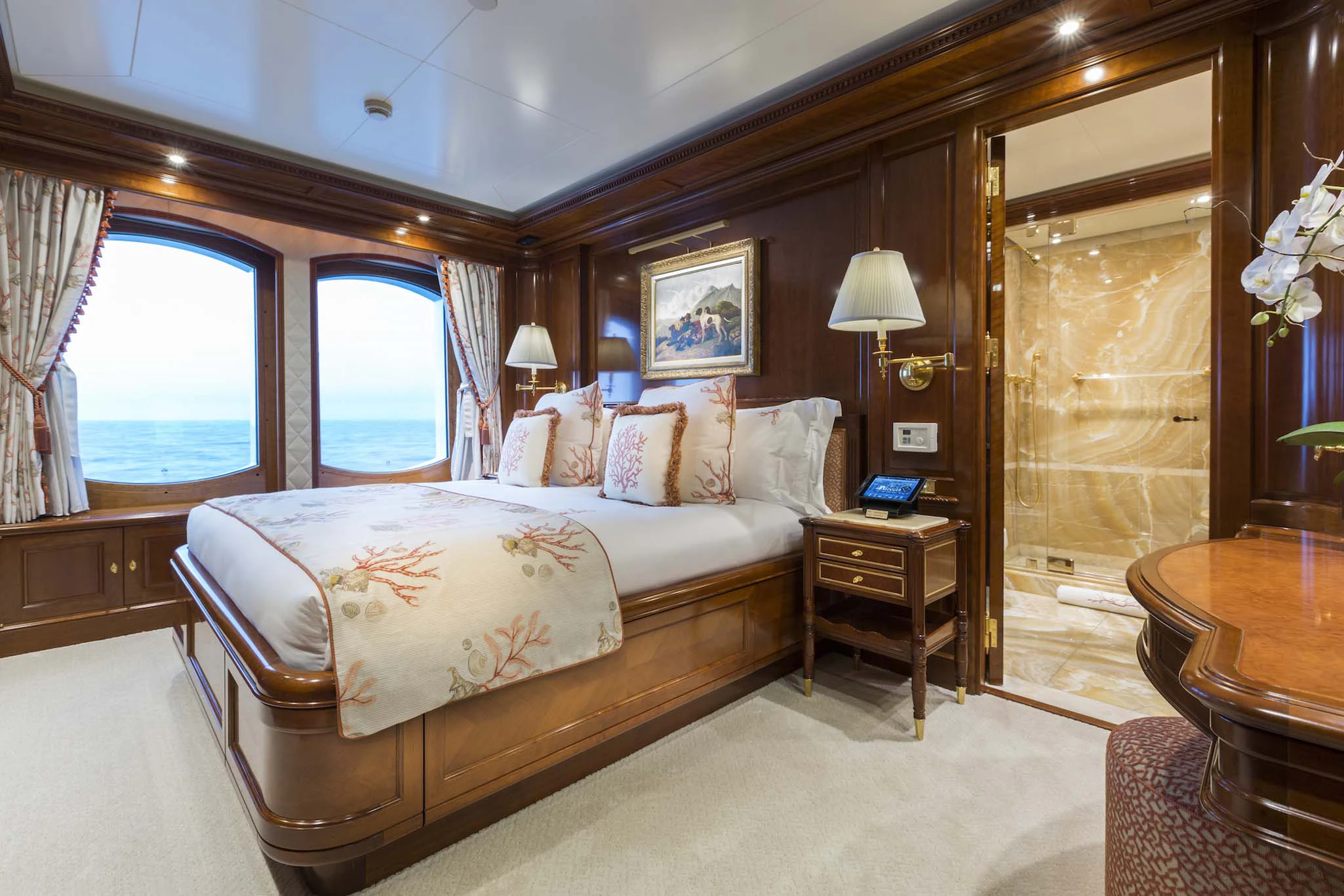 a bedroom with a bed and a window aboard KATHARINE Yacht for Sale