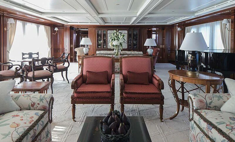 a living room with a piano aboard KATHARINE Yacht for Sale