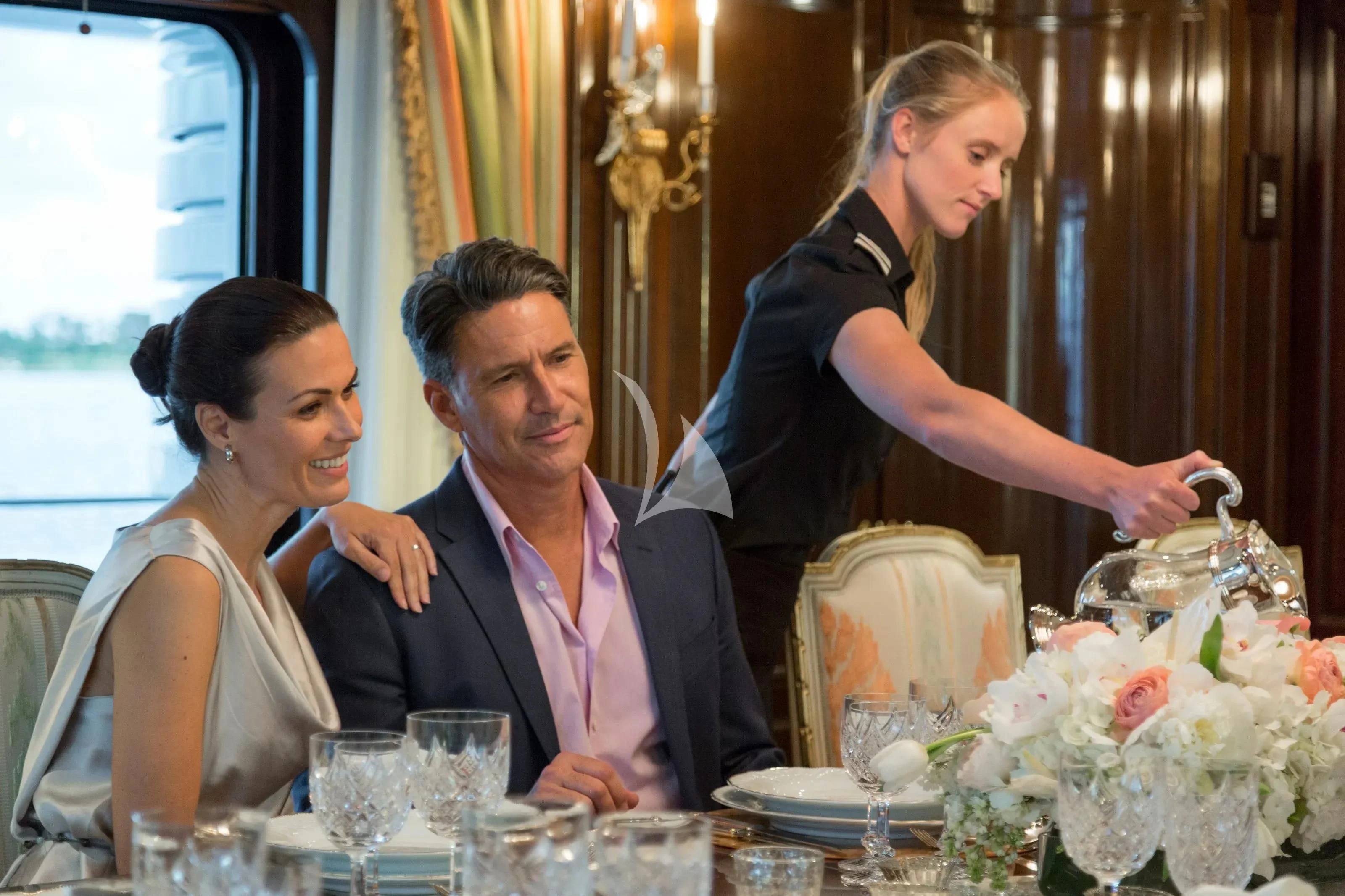 a person cutting a cake with a knife aboard KATHARINE Yacht for Sale