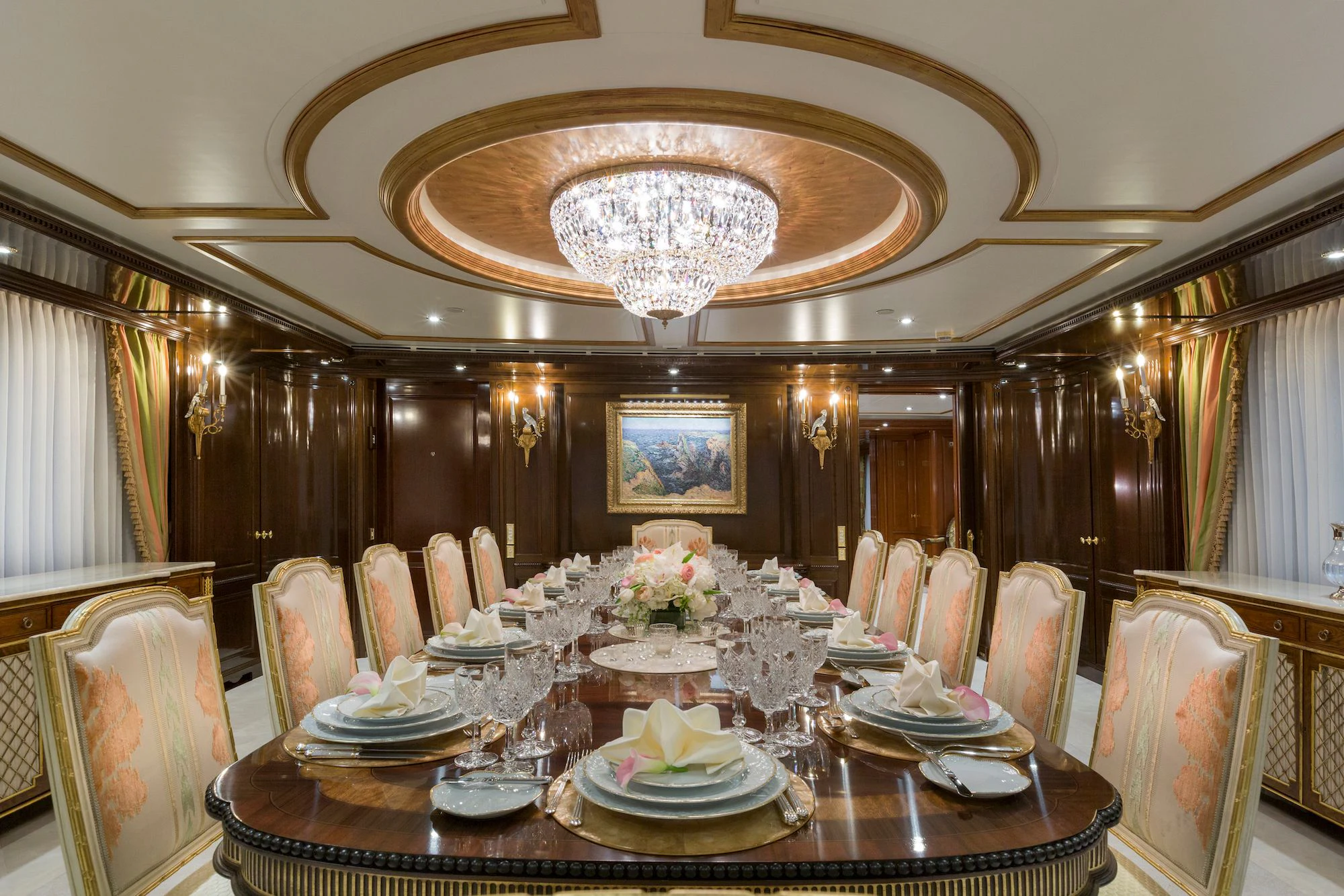 a dining room with a chandelier aboard KATHARINE Yacht for Sale
