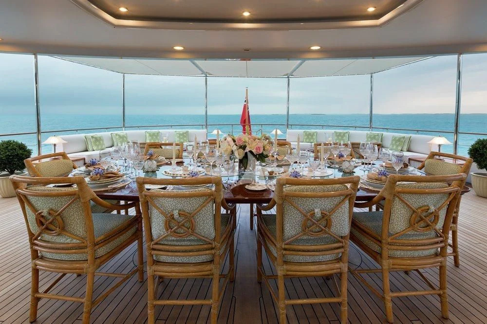 a table set for a dinner party aboard KATHARINE Yacht for Sale
