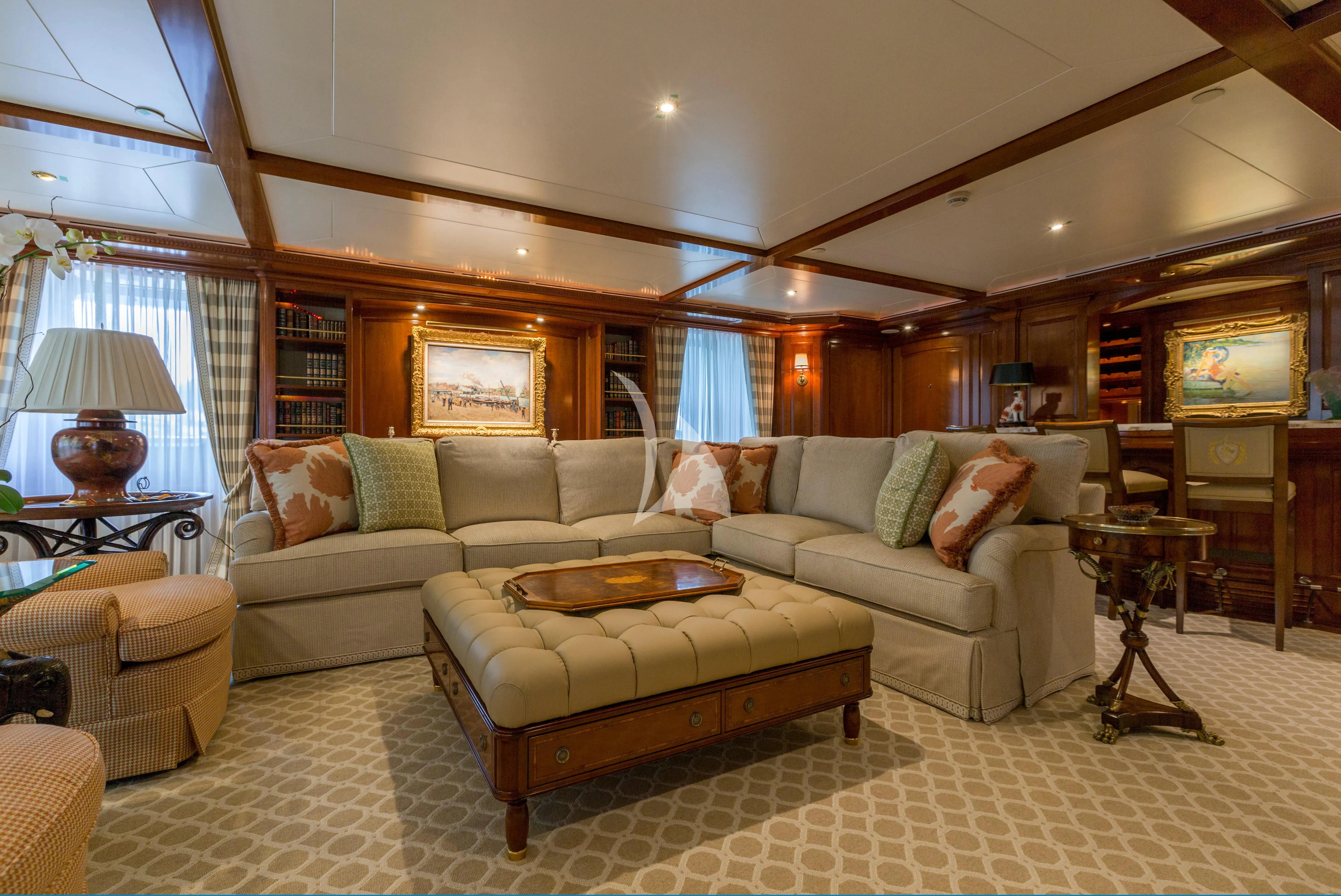a living room with a couch and a table aboard KATHARINE Yacht for Sale