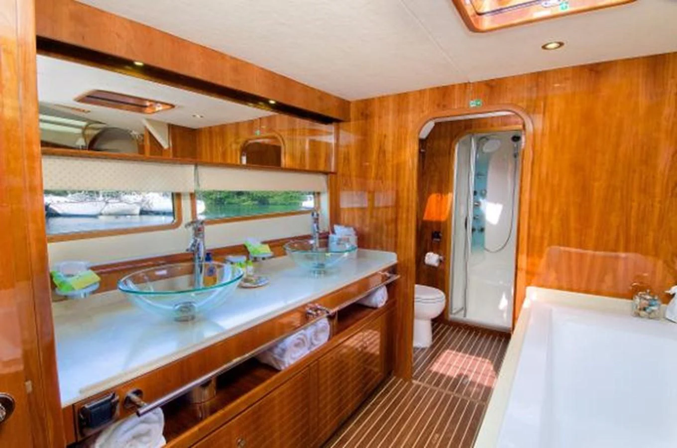 a bathroom with a sink and tub aboard 74' PRIVILEGE 2010 Yacht for Sale