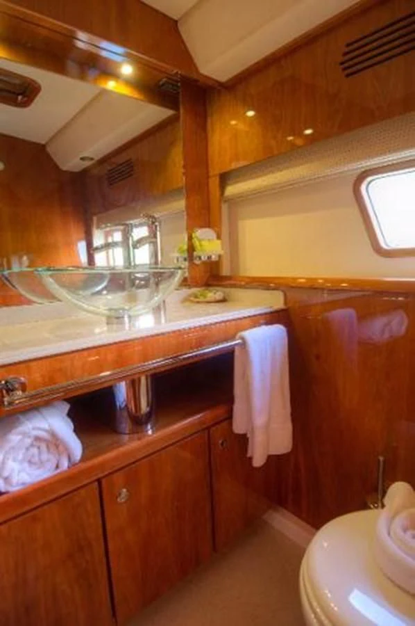 a kitchen with a glass sink aboard 74' PRIVILEGE 2010 Yacht for Sale