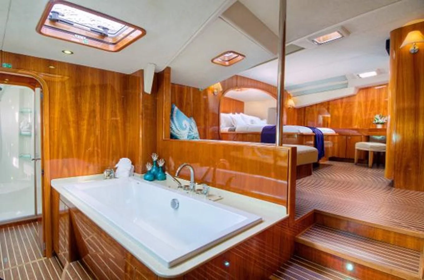 a large bathroom with a large bathtub aboard 74' PRIVILEGE 2010 Yacht for Sale
