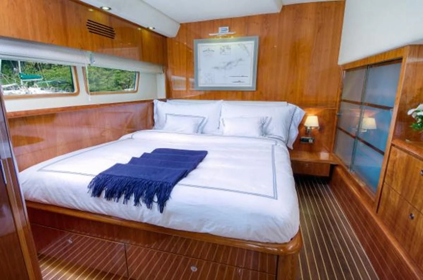 a bed in a room aboard 74' PRIVILEGE 2010 Yacht for Sale