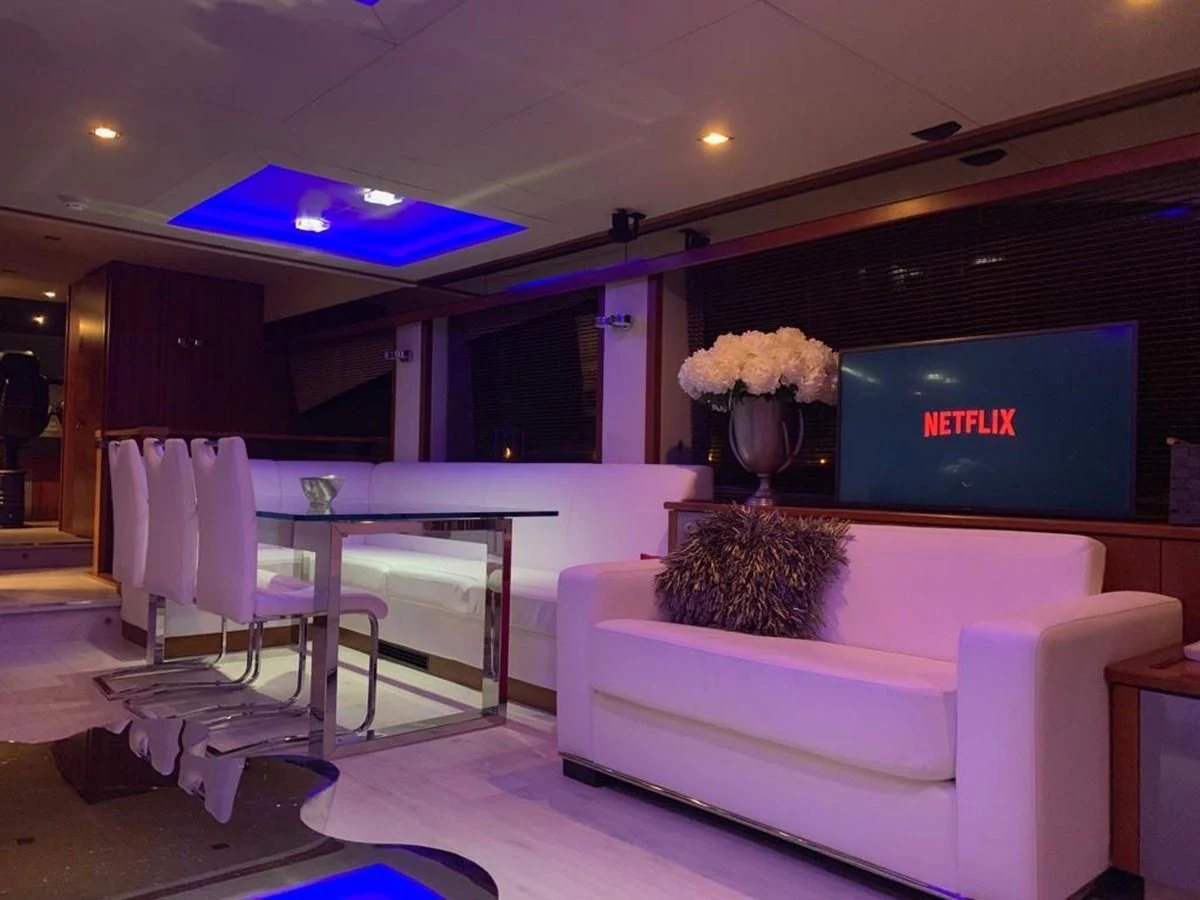 a room with a couch and a tv aboard LI-JOR Yacht for Sale