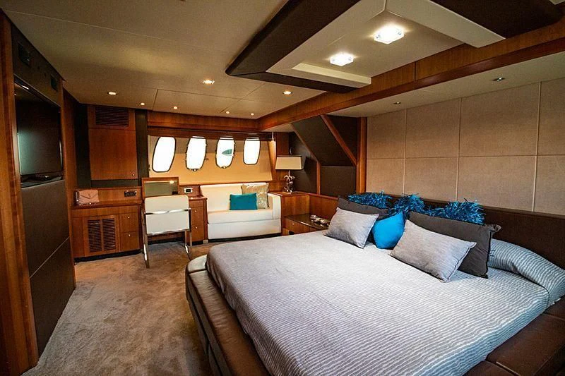 a room with a bed and a desk aboard LI-JOR Yacht for Sale