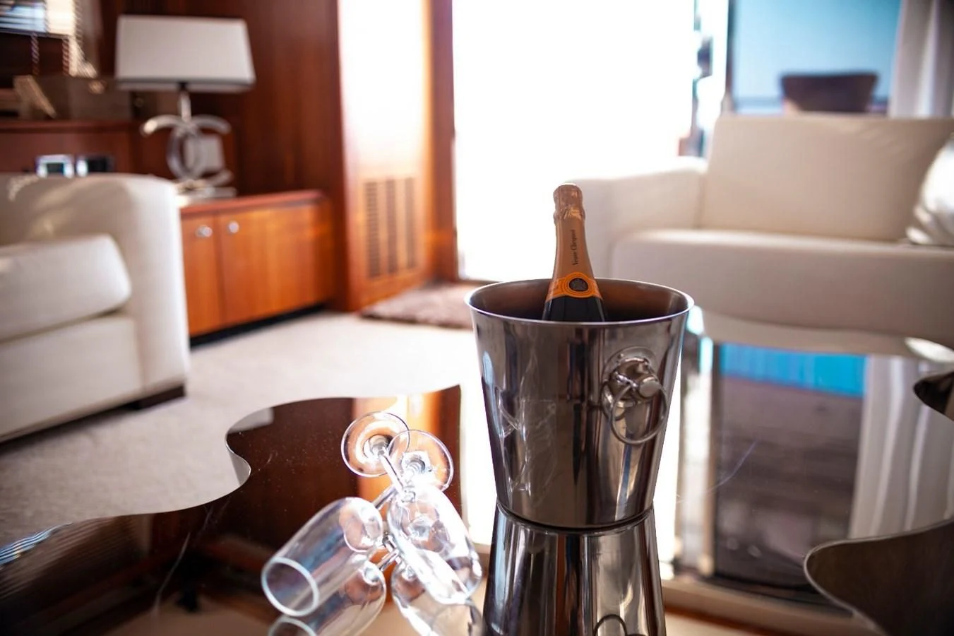 a glass bottle on a table aboard LI-JOR Yacht for Sale
