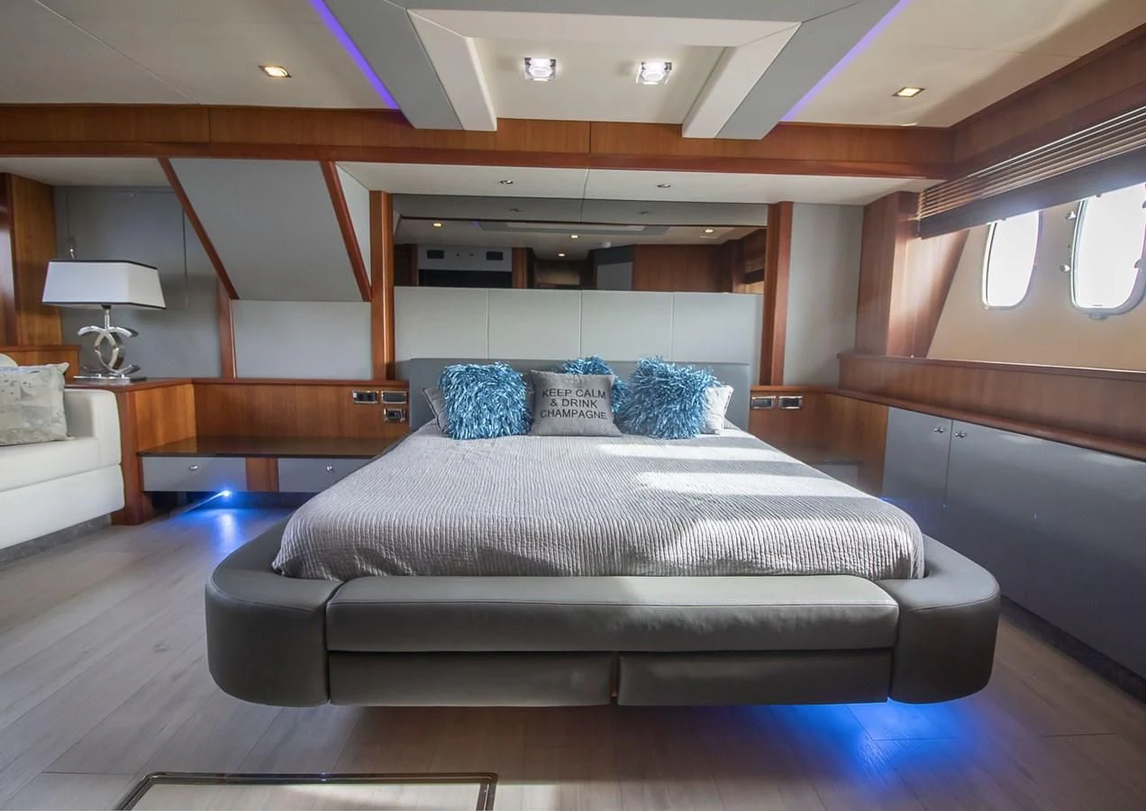 a large bed in a room aboard LI-JOR Yacht for Sale