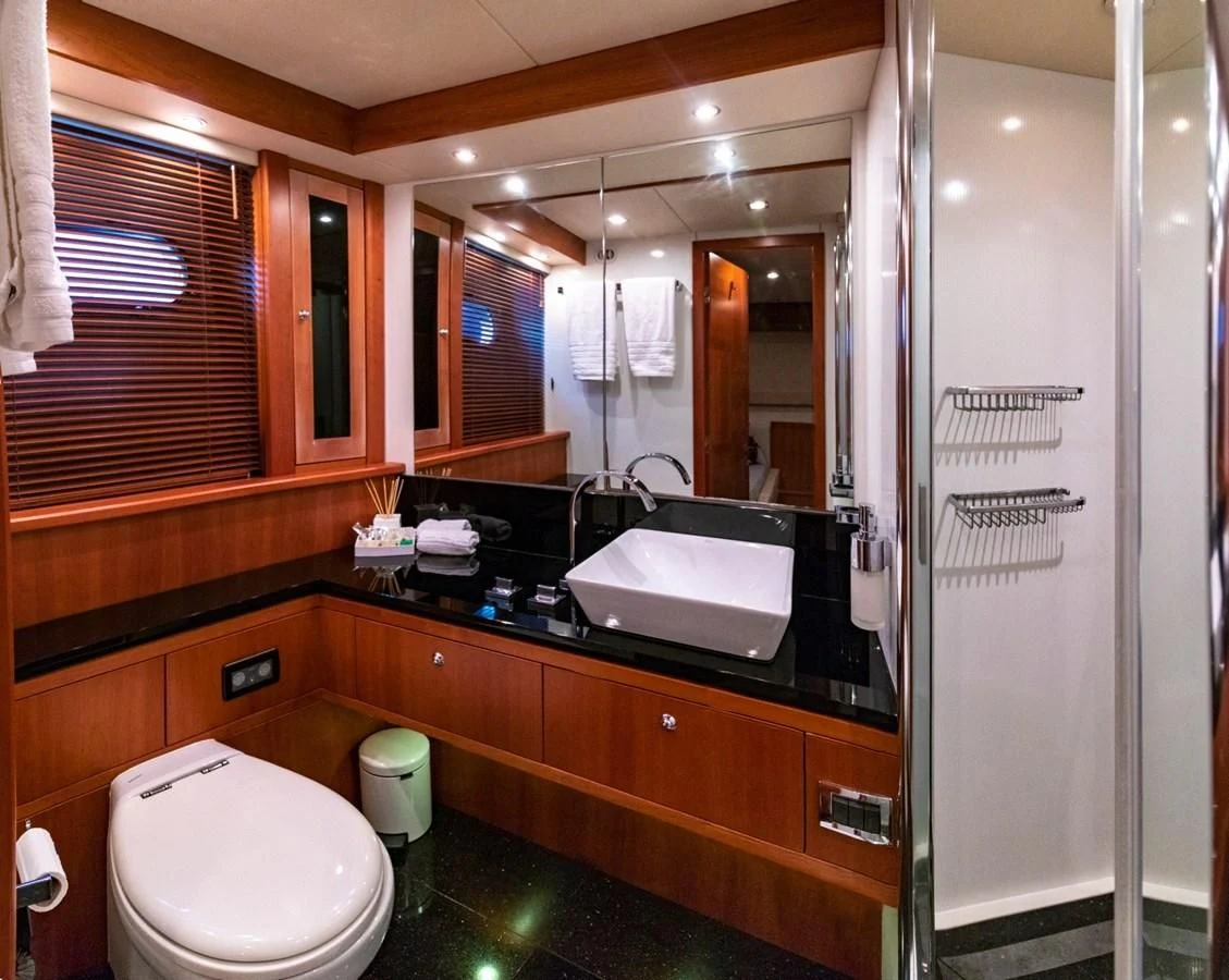 a bathroom with a large mirror aboard LI-JOR Yacht for Sale
