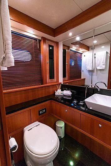 a bathroom with a toilet and a sink aboard LI-JOR Yacht for Sale