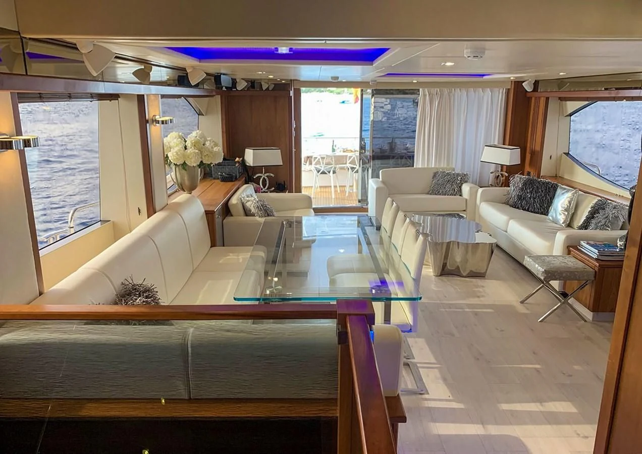 a large living room with a large window aboard LI-JOR Yacht for Sale