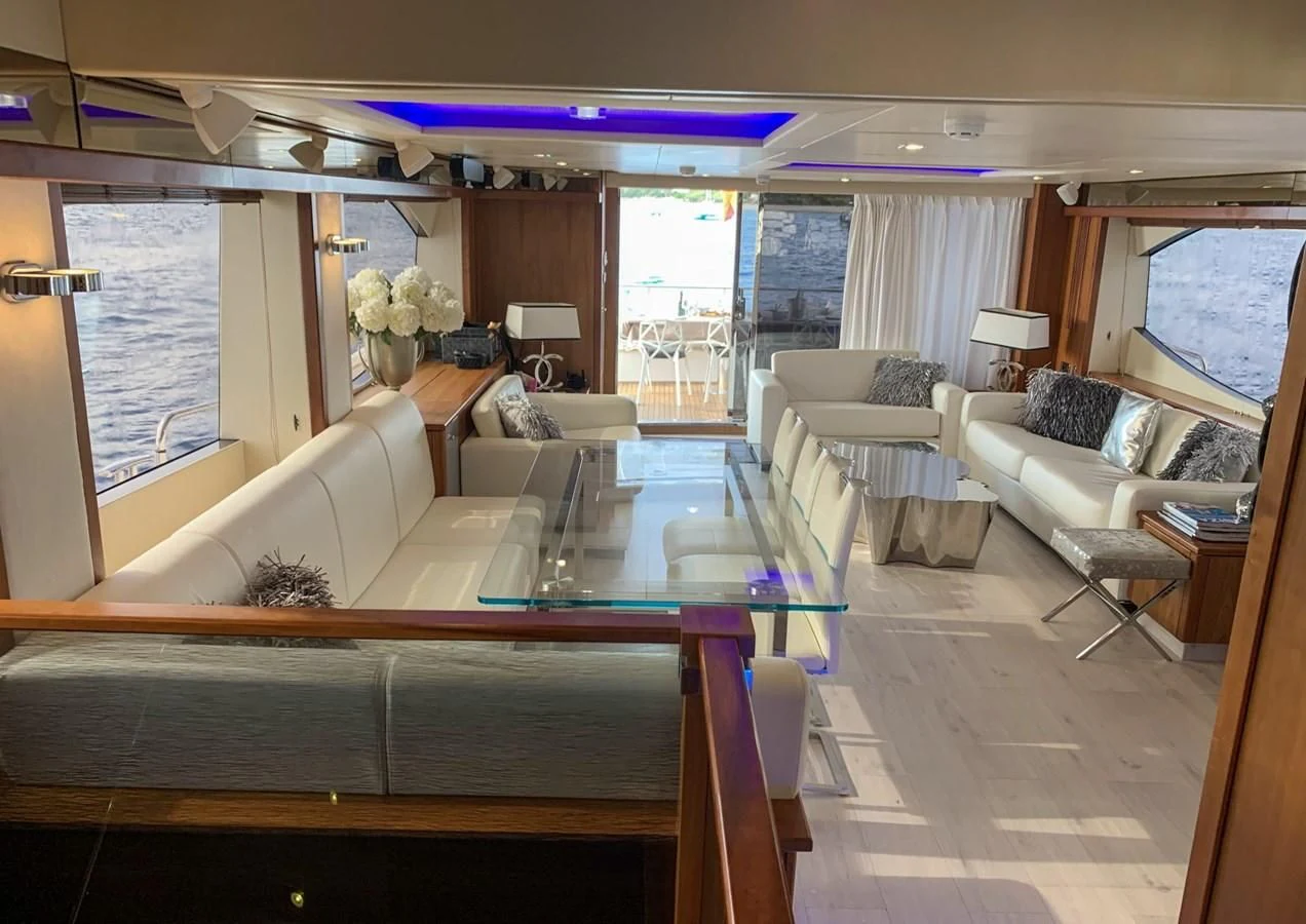 a large living room with a large window aboard LI-JOR Yacht for Sale