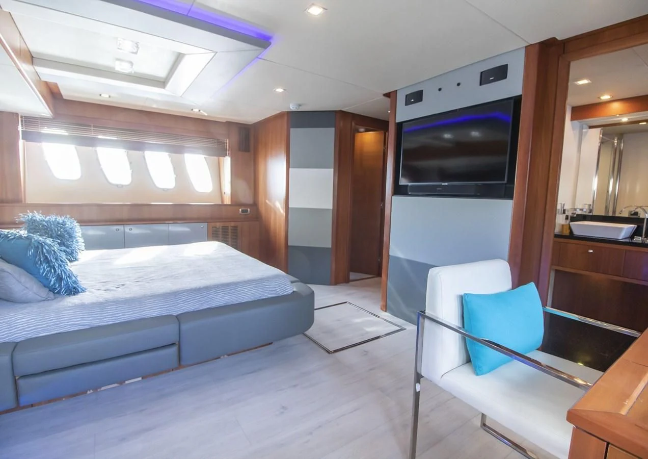 a room with a bed and a television aboard LI-JOR Yacht for Sale