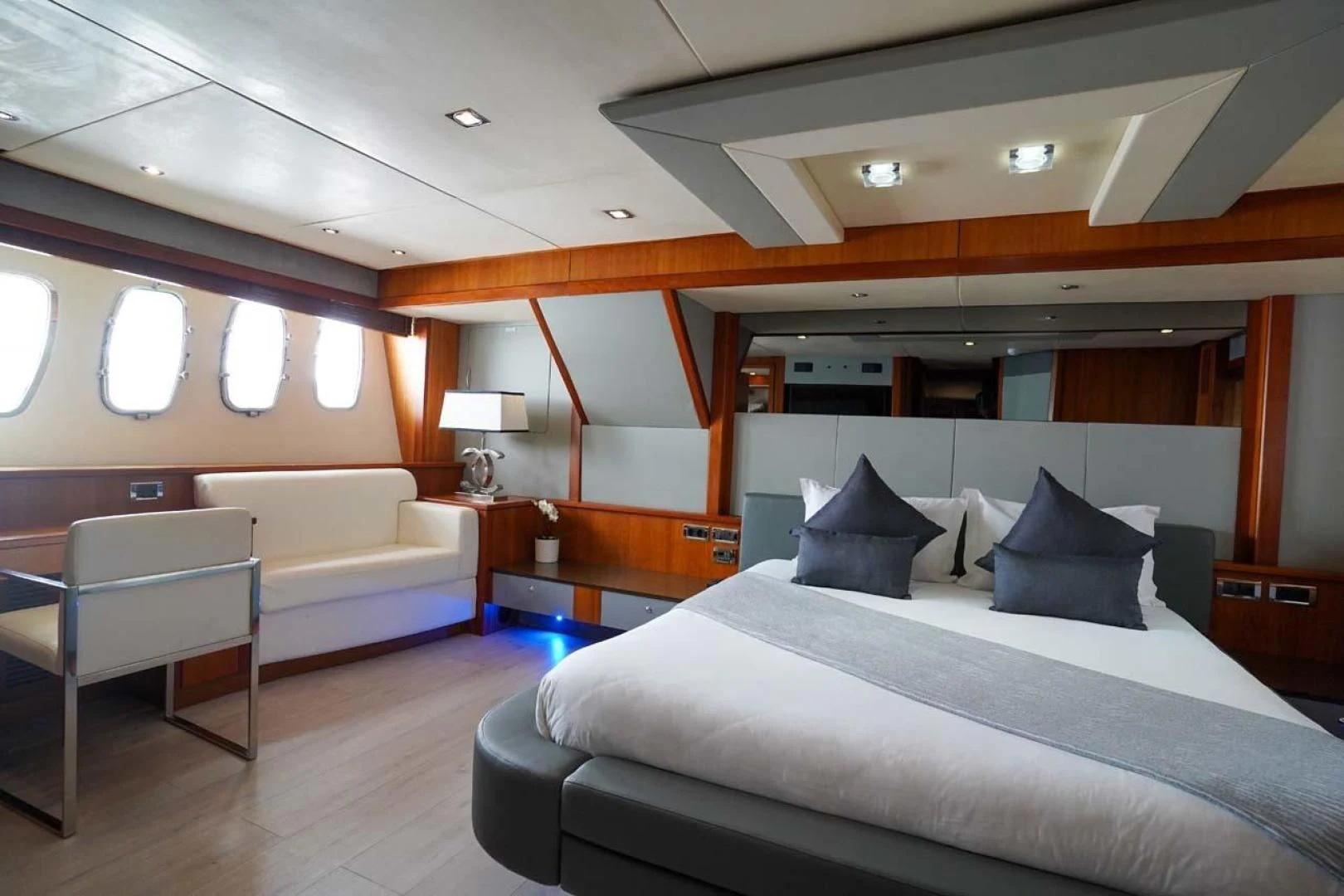a room with a bed and a chair aboard LI-JOR Yacht for Sale