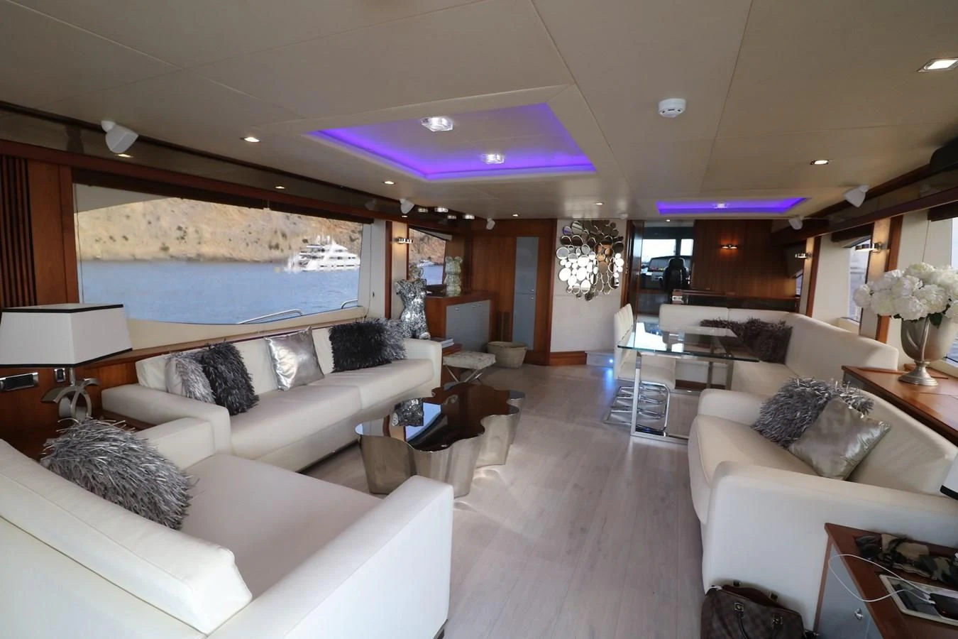 a living room with a large screen aboard LI-JOR Yacht for Sale