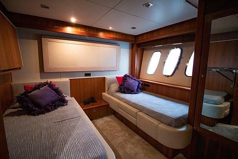 a room with a bed and a mirror aboard LI-JOR Yacht for Sale
