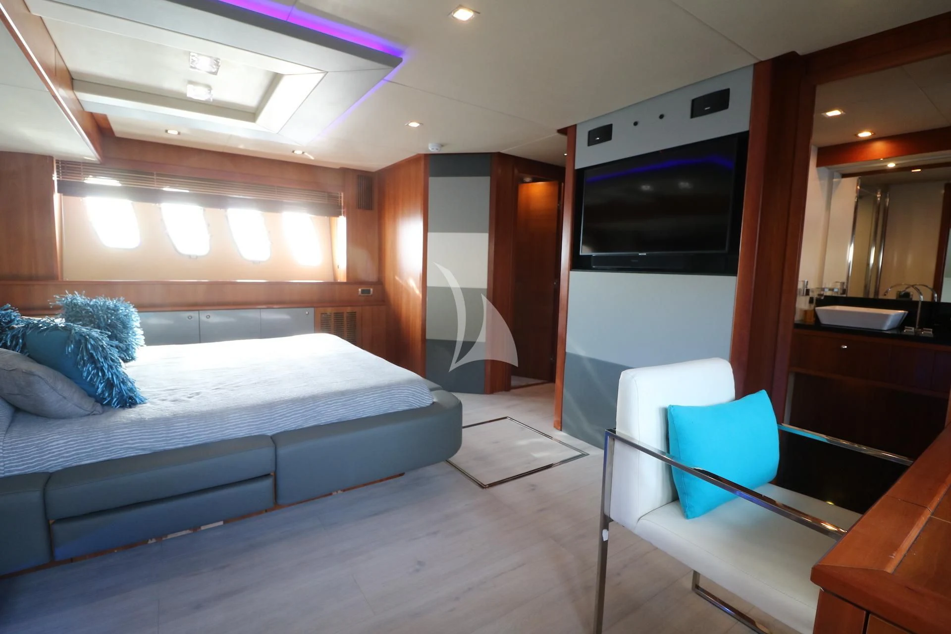 a room with a bed and a television aboard LI-JOR Yacht for Sale