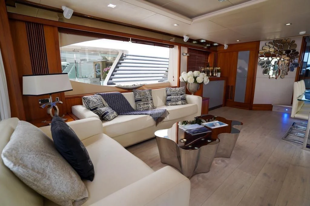 a living room with a large window aboard LI-JOR Yacht for Sale