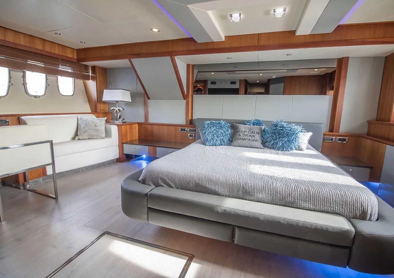 a room with a bed and a couch aboard LI-JOR Yacht for Sale