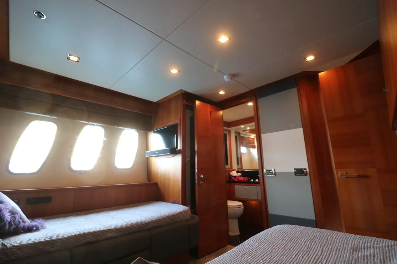 a room with a bed and a door aboard LI-JOR Yacht for Sale