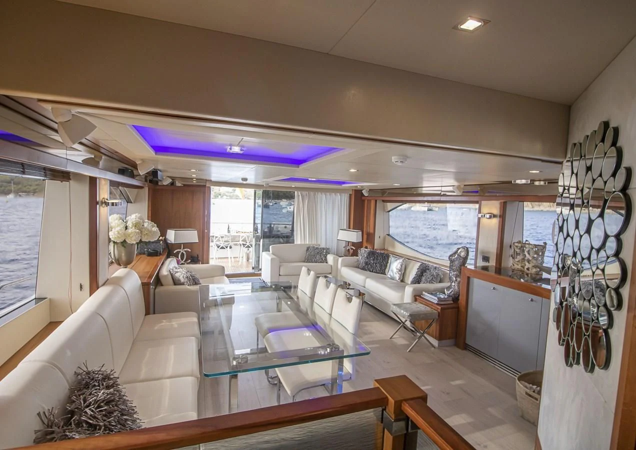 a living room with a large window aboard LI-JOR Yacht for Sale