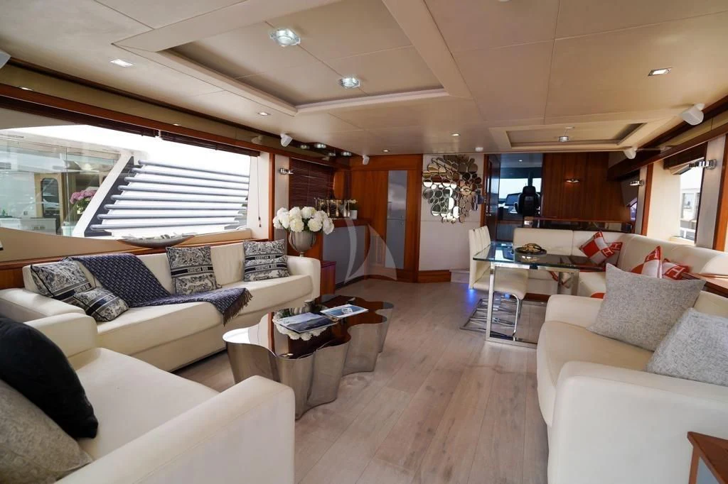 a living room with a large window aboard LI-JOR Yacht for Sale