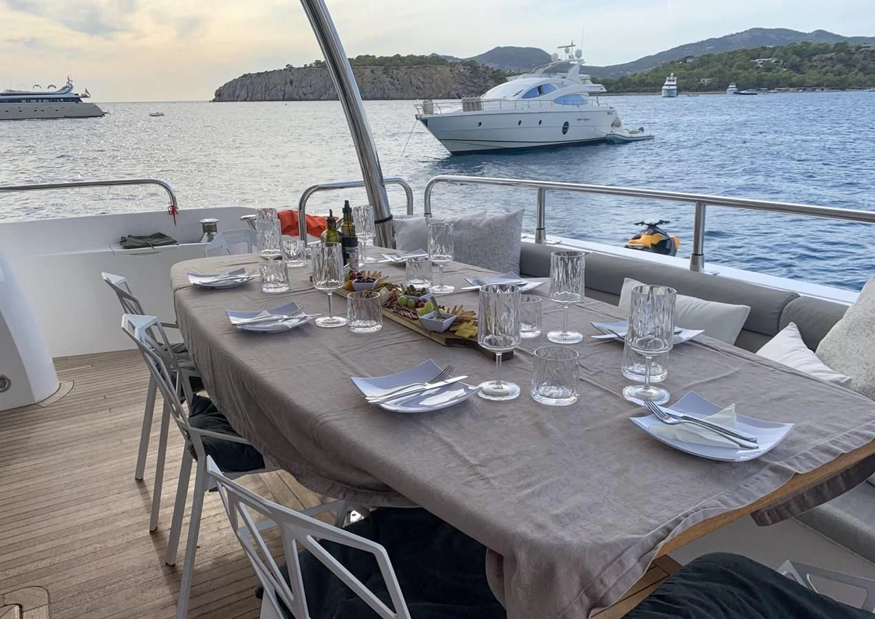 a table set for a dinner on a boat aboard LI-JOR Yacht for Sale